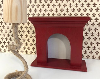 Small burgundy fireplace for a vintage dollhouse. Beautiful and stylish miniature fireplace.perfect furniture for a house on a scale of 1/6