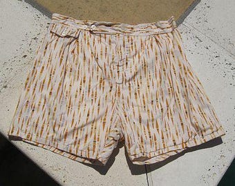 May include: White swim trunks with a brown and white striped pattern.