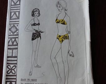 May include: Vintage sewing pattern titled "Polynesian Pattern 153" featuring illustrations of two women in swimwear. The pattern includes text that reads "Easy to Make" and specifies no special materials or machine attachments are needed.