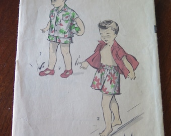 May include: Vintage sewing pattern for a boy's outfit. The pattern is for a shirt and shorts. The pattern is for size 1, chest 20 inches. The pattern is from Advance, pattern number 5280.