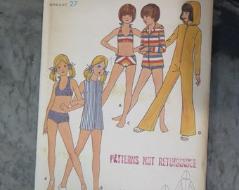 May include: Vintage Butterick sewing pattern envelope, size 8, featuring illustrations of children's swimwear and a jumpsuit. The envelope is cream-colored with the text "Butterick" and "6236". The breast size is 27 inches.