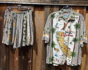 May include: A white and black patterned short-sleeved shirt with a map of California and the text "California" on the front. The shirt is paired with matching white and black patterned shorts.
