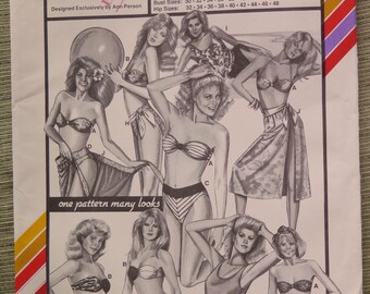 May include: A sewing pattern for a blouson and bikini swimsuit with a sarong. The pattern number is 1376. The pattern is designed by Anh Person. The pattern includes instructions for sewing machines and sergers. Bust sizes are 30-32-34-36-38-40-42-44-46. Hip sizes are 32-34-36-38-40-42-44-46-48.