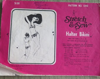 May include: A pink sewing pattern for a halter bikini. The pattern is called "Stretch & Sew" and includes instructions for sizes A, B, C, and D bra cups and hip sizes 28 to 40 inches.
