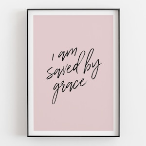 May include: A pink background with black calligraphy that reads "I am saved by grace".
