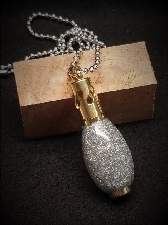 Aromatherapy Necklace in Brass made with diamond infused resin.