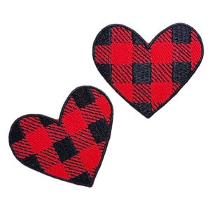 May include: Two red and black plaid heart-shaped patches.