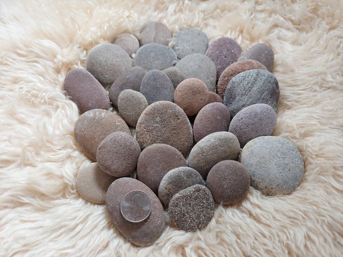 30 small round and oval smooth river rocks. From the Missouri Etsy