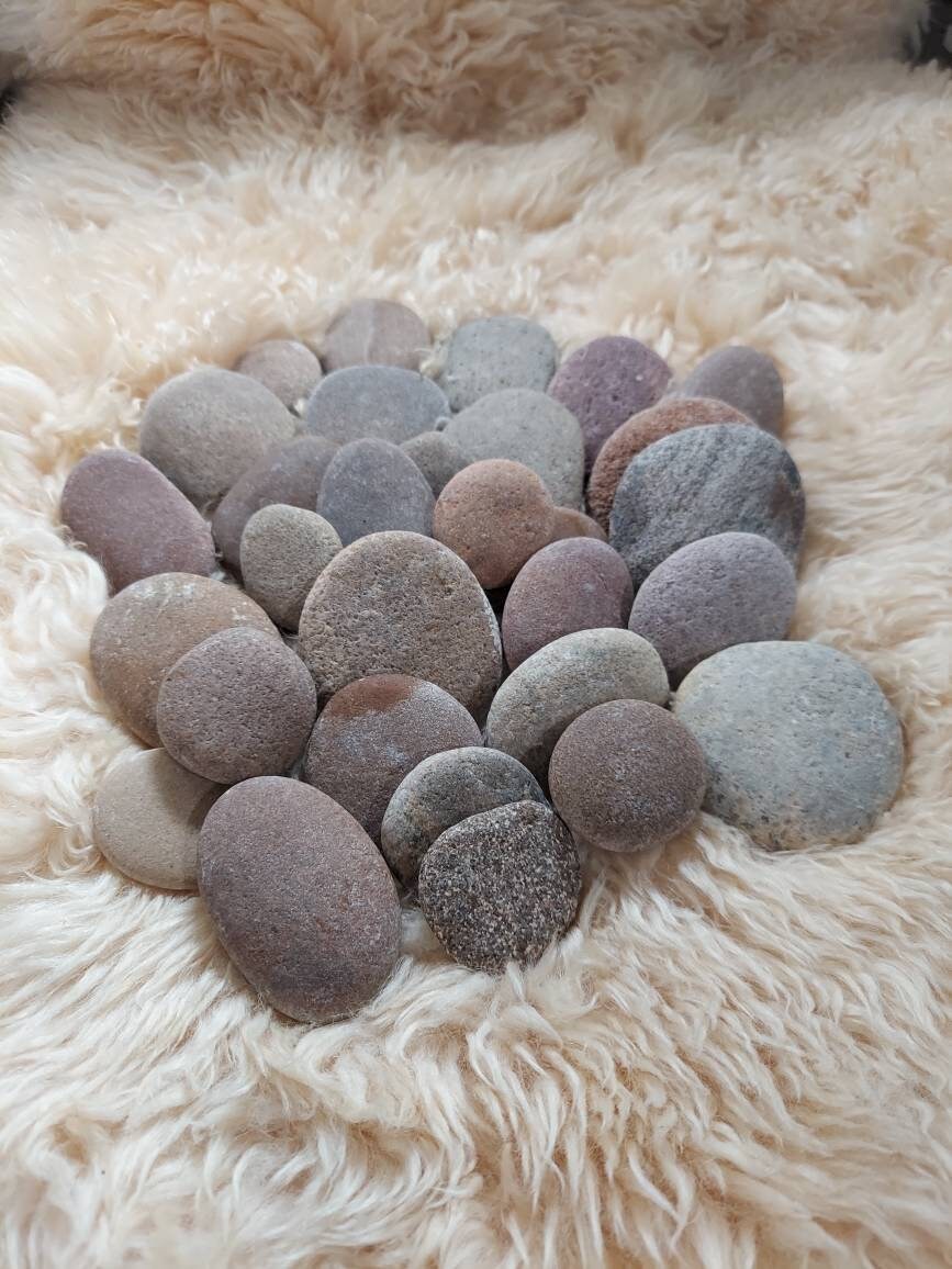 30 small round and oval smooth river rocks. From the Missouri Etsy