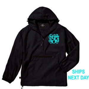 May include: Black hooded pullover jacket with a zipper and a large turquoise monogram on the front.