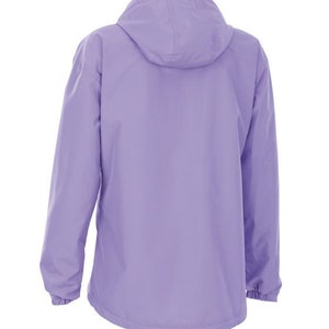 May include: A lilac hooded jacket with long sleeves. The jacket features a full zip and elasticated cuffs. The hood is attached and the jacket is made of a smooth, water-resistant material. Suitable for outdoor activities.