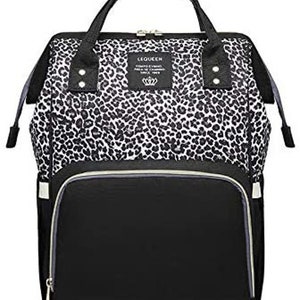 May include: Black and white leopard print diaper bag with a black zippered front pocket and the text "LEQUEEN COMFORT YOUR LIFE SINCE 1988" on a white tag.