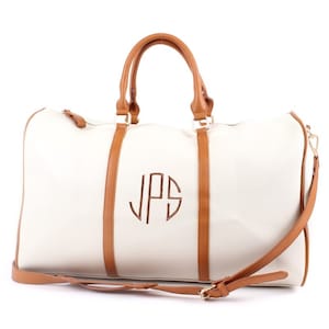 circle monogrammed cream duffel bag