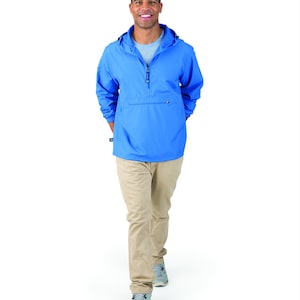 May include: A light blue pull-over jacket with a zipper and a kangaroo pocket. The jacket has a hood and is made of a water-resistant material.