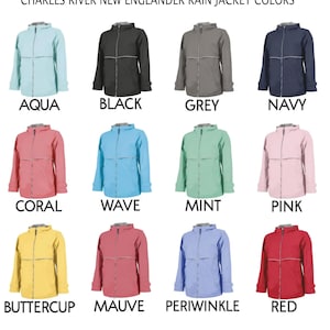 May include: Twelve Charles River New Englander rain jackets in various colors including aqua, black, grey, navy, coral, wave, mint, pink, buttercup, mauve, periwinkle, and red. Each jacket features a hood, a front zipper, and a horizontal reflective stripe.