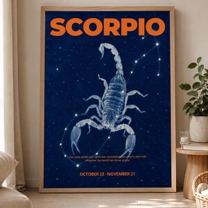 May include: A framed art print with the word "SCORPIO" in orange. It features a detailed scorpion illustration on a dark blue starry backdrop. The print includes a quote and the dates October 23 - November 21.