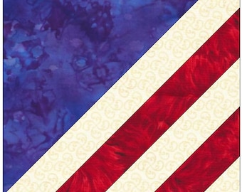May include: A quilt block with a diagonal pattern of red, white, and blue fabric. The blue fabric has a tie-dye pattern.