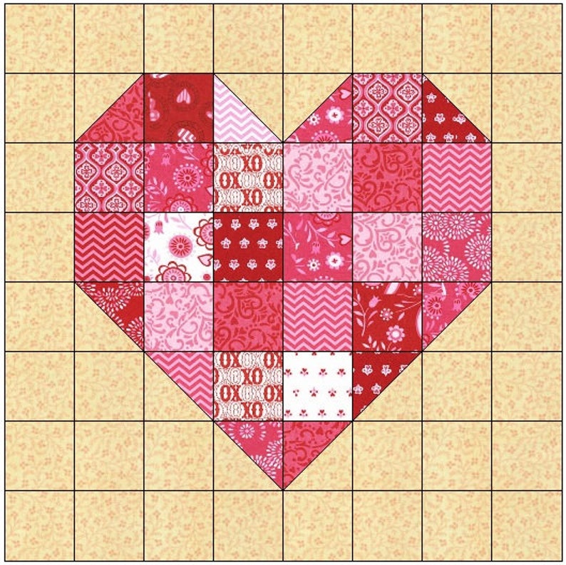 May include: A patchwork heart quilt block with a variety of pink, red, and white floral and geometric patterns. The block is set on a grid of 9 squares by 9 squares.