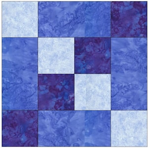 May include: A quilt block with a patchwork design featuring nine squares. The squares are in shades of blue and white. Some squares have a marbled or tie-dye effect.