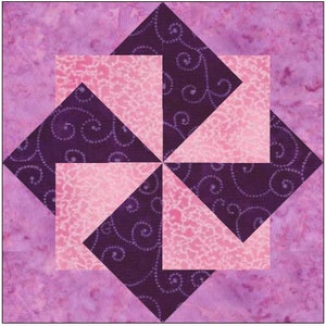 May include: A purple and pink quilt block with a pinwheel design. The block is made up of four triangles of each colour, with the purple triangles having a white swirl pattern.