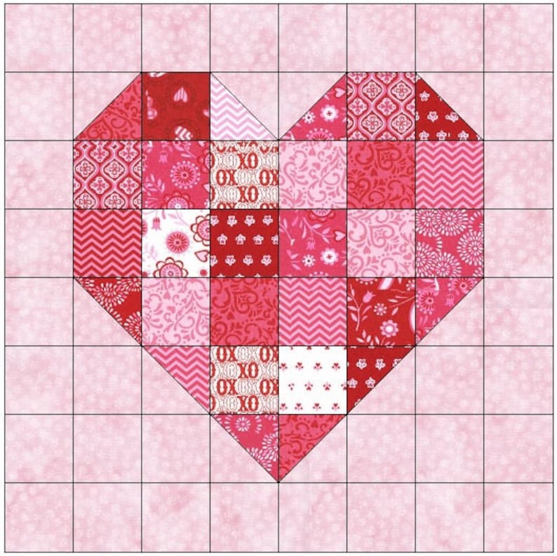 May include: A patchwork heart quilt block with a pink background and a red, white, and pink heart design. The heart is made up of smaller squares of fabric with different patterns.
