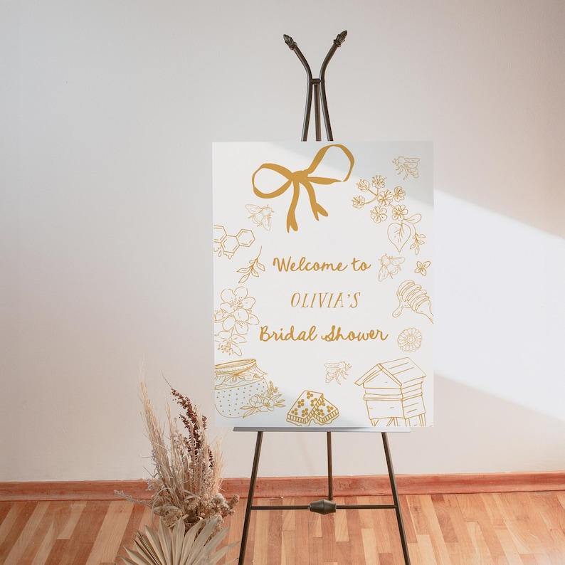 Editable bridal shower welcome sign featuring hand-drawn honey bees, honey jars, and a yellow bow. Perfect for a Bride to Bee or She Found Her Honey themed wedding shower.