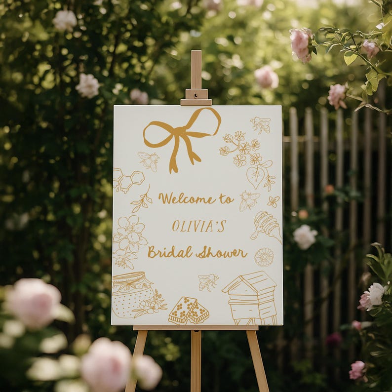 Editable bridal shower welcome sign featuring hand-drawn honey bees, honey jars, and a yellow bow. Perfect for a Bride to Bee or She Found Her Honey themed wedding shower.