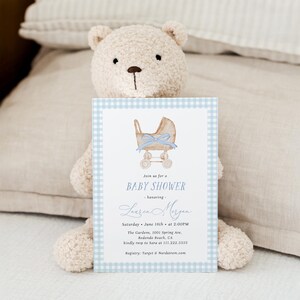Blue gingham baby shower invitation set featuring a vintage baby carriage illustration, soft baby boy colors, and classic traditional styling. Editable baby shower bundle with coordinated invitation, books for baby card, diaper raffle ticket, and thank you card for an elegant and timeless celebration.