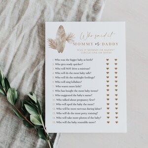 May include: A printable baby shower game with the title "Who said it Mommy or Daddy?"  The game asks 15 questions about the parents and the baby, with options for "Mommy", "Daddy", or both.  The game is designed with a brown and white color scheme and features a surfboard graphic.