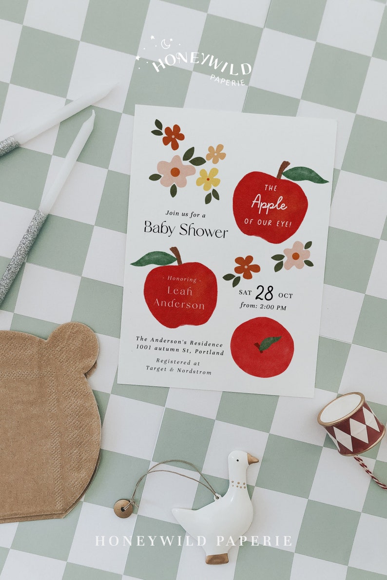 Apple baby shower invitation with hand-drawn red apples and florals, an editable apple of our eye baby shower template with a sweet, neutral style.
