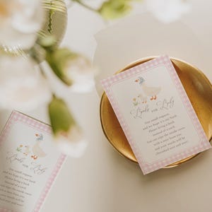 Pink gingham Silly Goose baby shower bundle featuring charming goose and gosling illustrations, soft baby girl colors, and vintage storybook styling. Coordinated girl goose baby shower decor collection with matching invitations, diaper raffle cards, books for baby cards, thank you cards, and printable party templates.