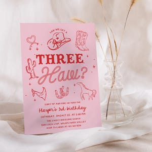 Pink cowgirl “Three Haw” 3rd birthday invitation with western boots, cowboy hat, cactus, and horse — editable printable rodeo theme party invite for girls.