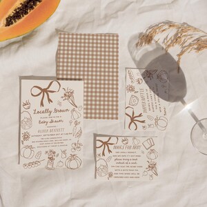 Editable fall baby shower invitation bundle with little pumpkin and locally grown baby shower theme, featuring hand-drawn harvest vegetables, pumpkins, bow details, and matching insert cards for an autumn baby shower celebration.