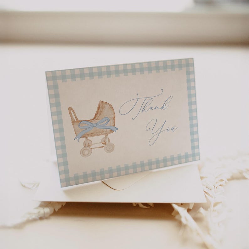 Blue gingham baby shower invitation set featuring a vintage baby carriage illustration, soft baby boy colors, and classic traditional styling. Editable baby shower bundle with coordinated invitation, books for baby card, diaper raffle ticket, and thank you card for an elegant and timeless celebration.