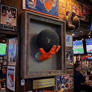 Alien hand wall mounted display for basketball