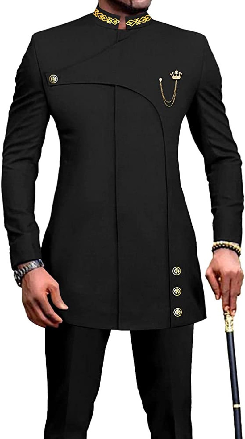 May include: A black suit with a mandarin collar and gold trim. The jacket has a single button closure and a gold crown pin. The pants have a straight leg.