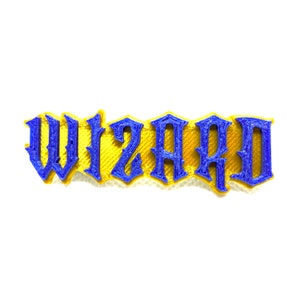 May include: A 3D printed word "WIZARD" in blue letters with a yellow outline.