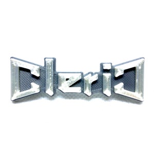 May include: A 3D printed gray and white plastic pin with the word "Cleric" in white letters.
