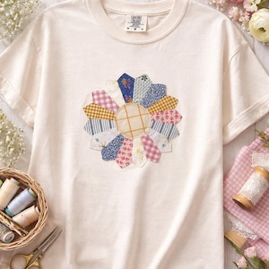 May include: A set of three ceramic mugs with a speckled, matte finish. The mugs are in shades of cream, light gray, and dark gray. Each mug has a simple, minimalist design, perfect for coffee or tea.