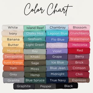 May include: A colour chart showing a selection of fabric colours, including white, ivory, and black. The chart features a range of hues, from light pastels to deep, saturated tones. The text "Color Chart" is written in cursive at the top.