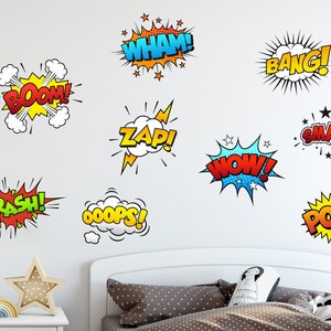 May include: A white wall with nine colorful comic book sound effect word bubbles. The words include "WHAM!" "BANG!" "BOOM!" "ZAP!" "CRASH!" "OOPS!" "HOW!" "SMASH!" and "POW!"