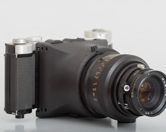Tominon 127mm F4.7 Lens in Polaroid Copal Shutter W/ 3 5/8 Board