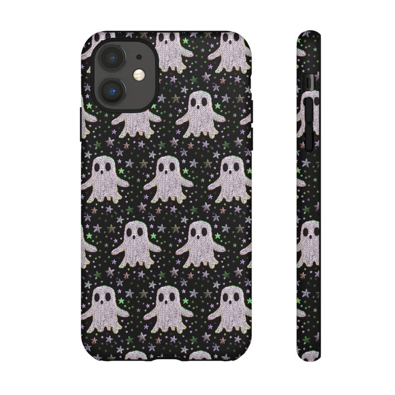 Black phone case featuring white textured ghost pattern with multicolored star accents. Kawaii-style ghosts with simple black eyes on dark background.