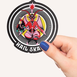 Vibrant 'Hail Skatin'' sticker featuring a colorful goat demon with roller skates, embodying a quirky mix of satanic and skate culture. Perfect for adding some edgy flair to your belongings.