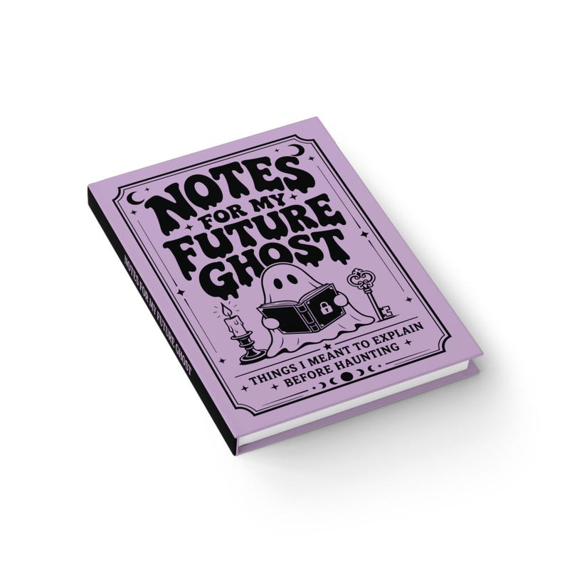 A 5 by 7 inch hardcover journal with a matte pastel purple cover and black printed graphics. The front features a retro inspired illustration of a white ghost character. One design shows the ghost holding a locked book flanked by a lit candle and a skeleton key with text reading Notes For My Future Ghost. The other shows the ghost peeking over a blank label with text reading Property Of The Future Ghost. Both include crescent moons, four point stars, and vintage decorative border frames.