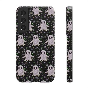 Black phone case featuring white textured ghost pattern with multicolored star accents. Kawaii-style ghosts with simple black eyes on dark background.