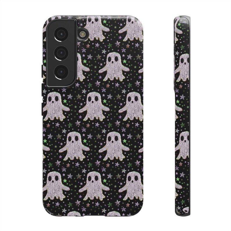 Black phone case featuring white textured ghost pattern with multicolored star accents. Kawaii-style ghosts with simple black eyes on dark background.