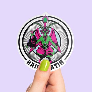 Sticker featuring a rollerskating goat figure inspired by Baphomet, holding a roller skate. The text 'Hail Skatin' appears below, blending rebellious skate culture with occult symbolism in a bold and edgy style.