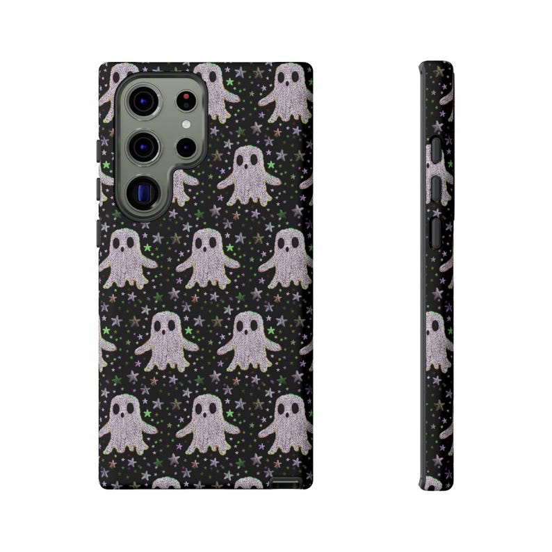 Black phone case featuring white textured ghost pattern with multicolored star accents. Kawaii-style ghosts with simple black eyes on dark background.