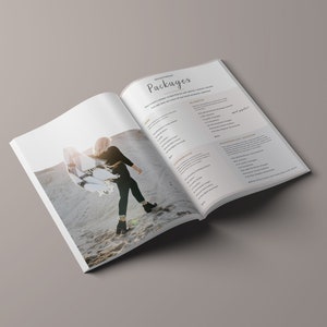 May include: Open book with a photography package price list on the right page and a photo of a woman wearing a black shirt and a white and black scarf on the left page.